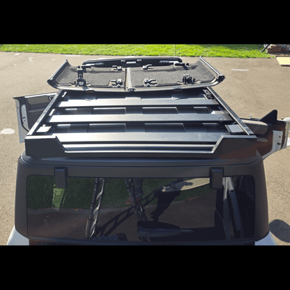 Close-up image of a roof rack securely installed on a Ford Bronco, showing mounting brackets and sturdy construction details.