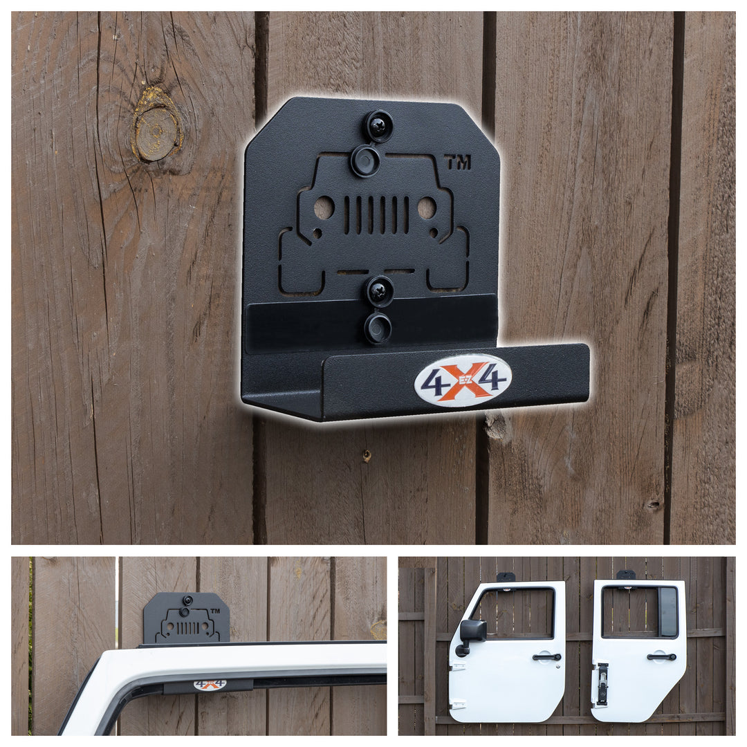 Black EZ4X4 door hanger mounted on wooden fence, with white Jeep doors hung securely, showcasing sturdy, convenient storage.