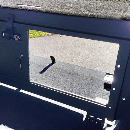Exterior view of EZTrunk with sliding panel open, highlighting easy access, secure cargo storage, and rugged modular design.