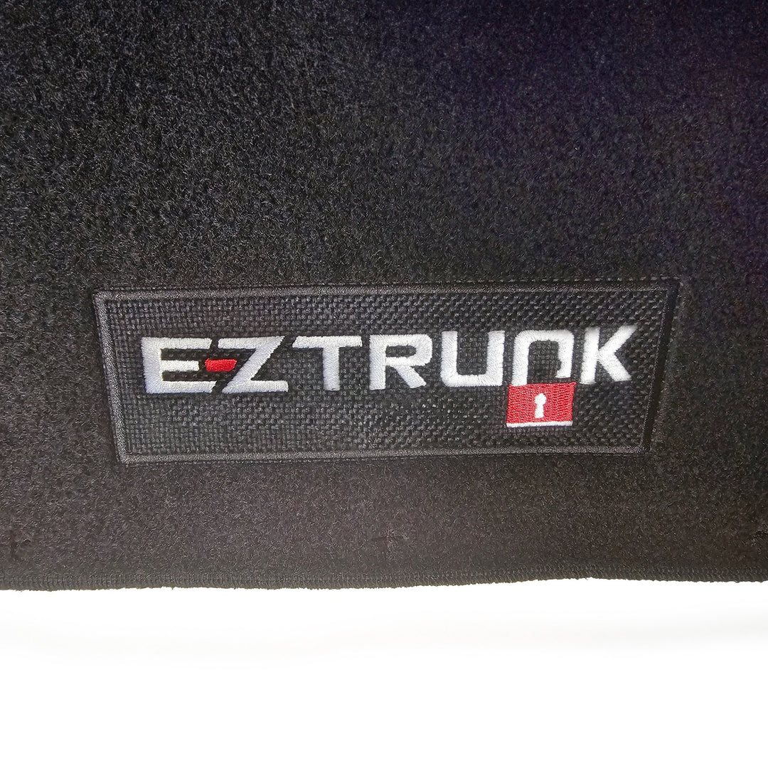 Black carpet mat with 'EZ Trunk' logo shown on white background.