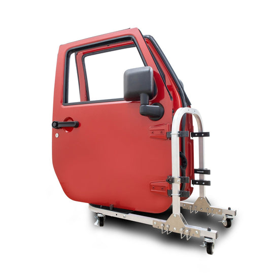Expanded EZ4X4 aluminum door cart against white background holding two red Jeep doors, showing secure storage design.
