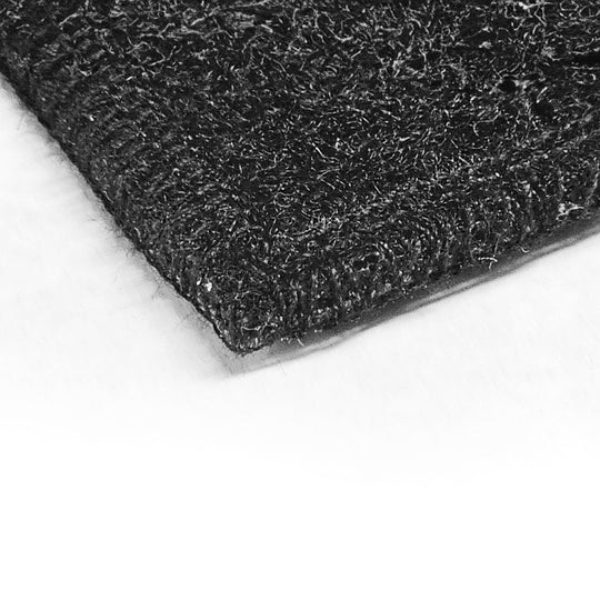 Close-up of carpet texture from custom-fit kit, highlighting dense weave and durable material for vehicle interior protection.