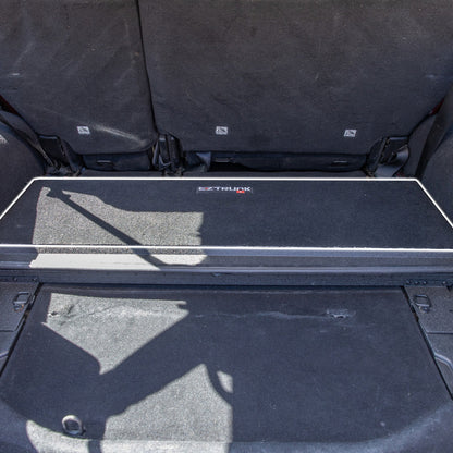 Black carpet mat with 'EZ Trunk' logo installed.