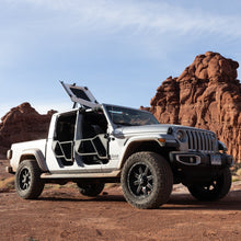 White Jeep Gladiator with EZ4X4 Razor half-tube doors and FlipTop open, parked in desert with red rock formations.
