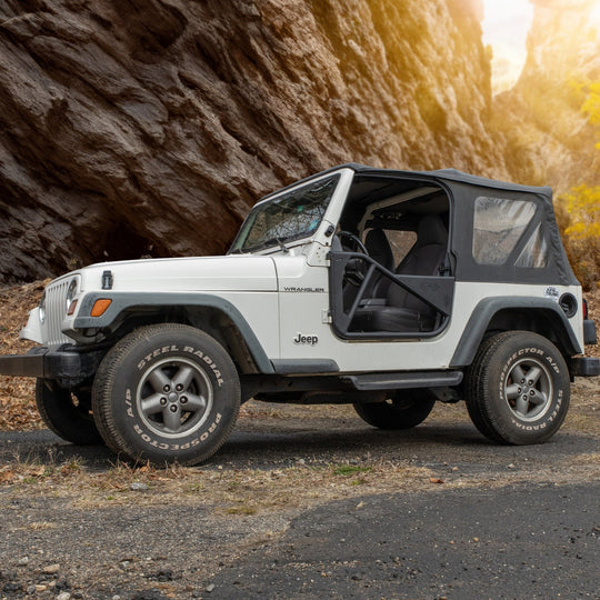 White Jeep with black Phantom aluminum doors, showing modular design and rugged off-road aftermarket protection.