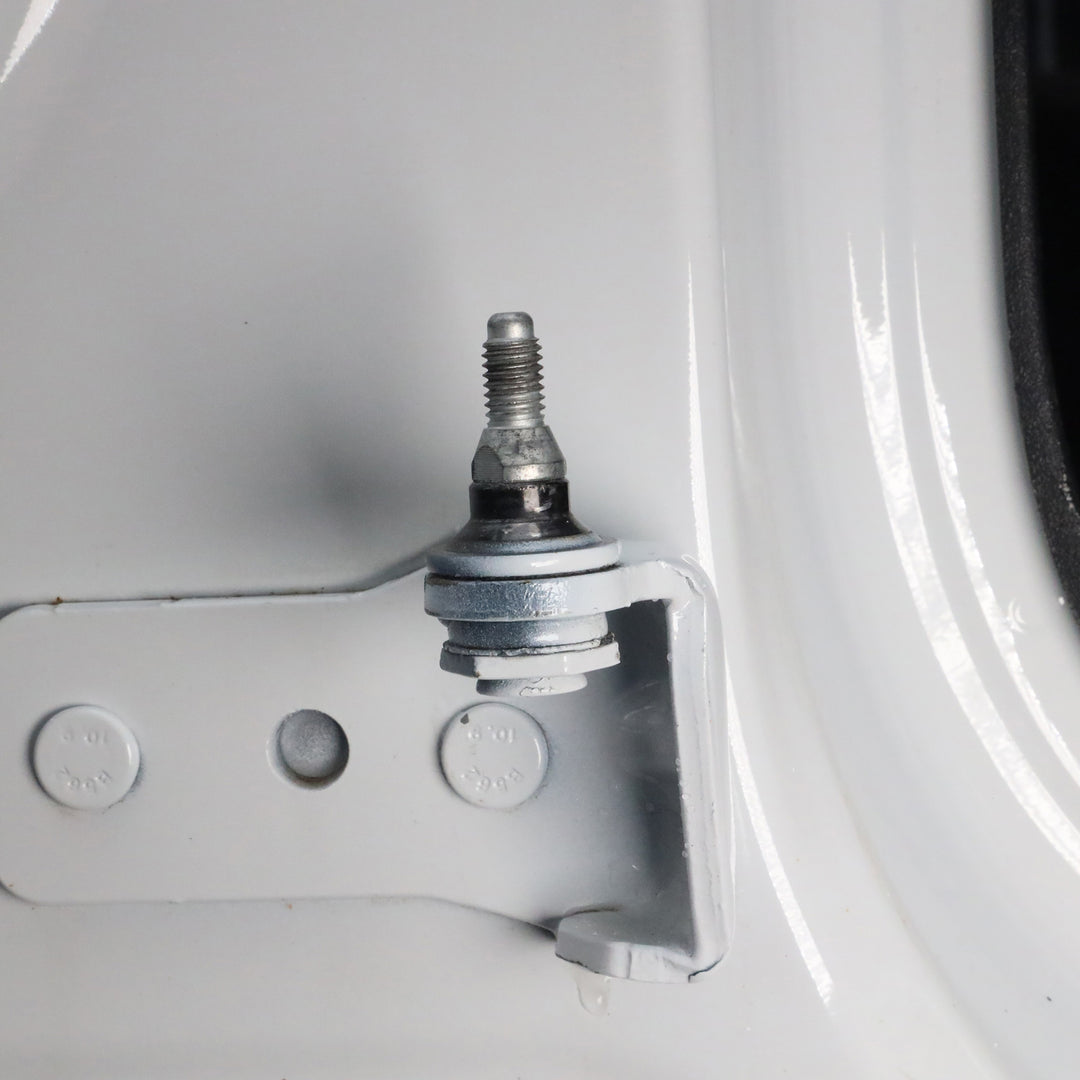 Close-up of fully installed door alignment pin in Ford Bronco hinge, showing correct final position and proper alignment.
