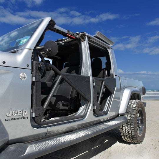Gray Jeep Gladiator with EZ4X4 black Phantom doors parked at the beach, showcasing rugged, open-air off-road style.