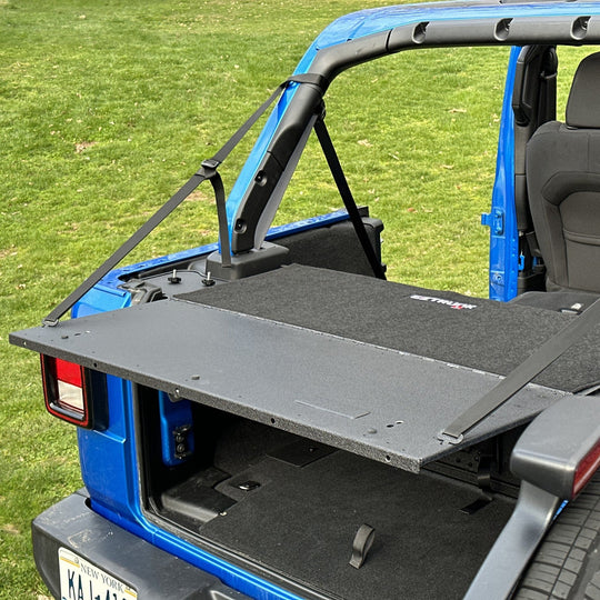 Finished custom carpet kit neatly fitted outside EZ trunk, showcasing clean edges and durable interior protection.