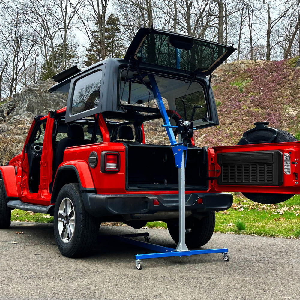 EZ4x4 hardtop lift removing Jeep Wrangler roof, shown above red vehicle for safe, one-person roof removal and storage.
