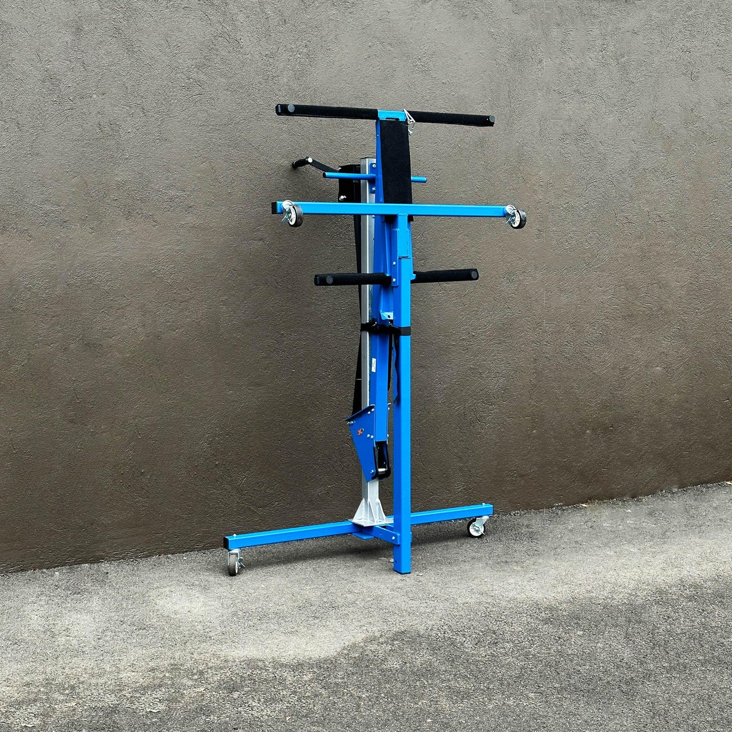 EZ4x4 blue steel hardtop lift compacted against wall, showing space-saving design for easy storage when not in use.