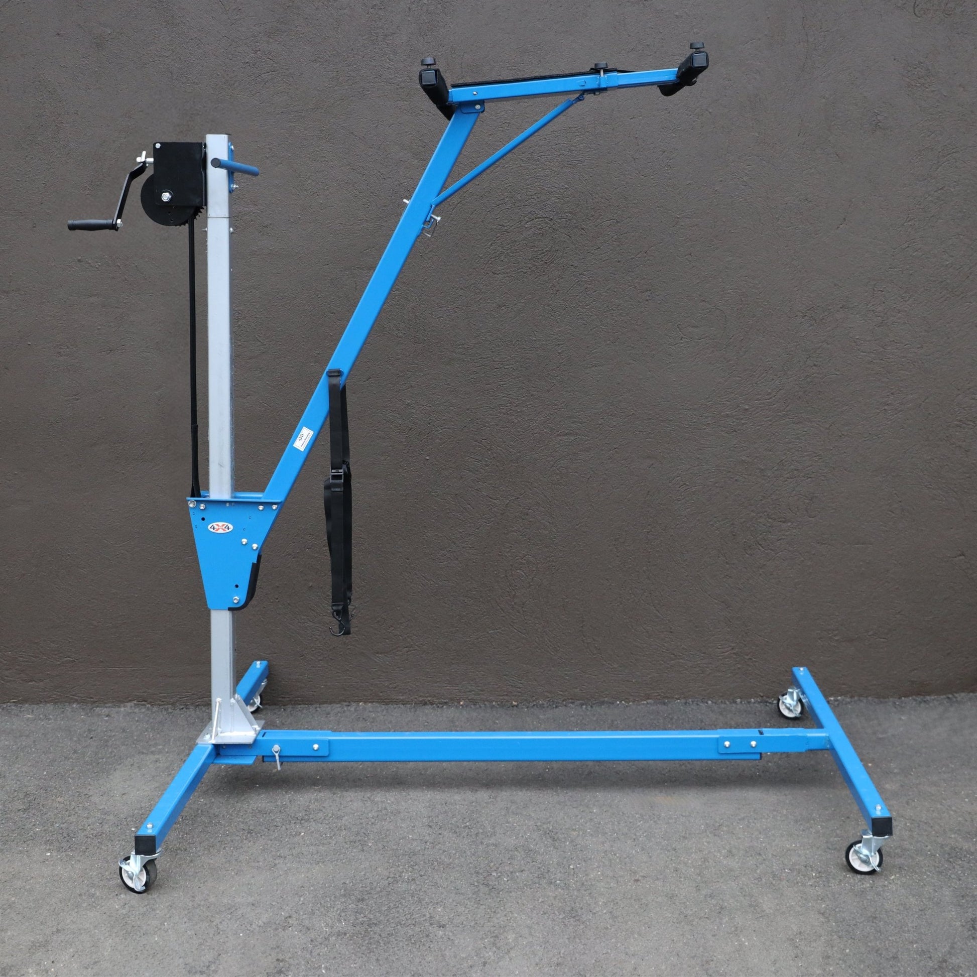 Side view of expanded blue steel hardtop lift tool, enabling safe and easy one-person removal of Bronco hard top panels.