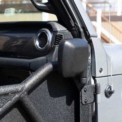 Rectangular aluminum side mirror folded up on white Jeep, showcasing durable aftermarket design and off-road readiness.