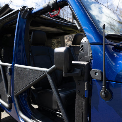Rectangular aluminum side mirror folded up on blue Jeep, showcasing durable aftermarket design and off-road readiness.