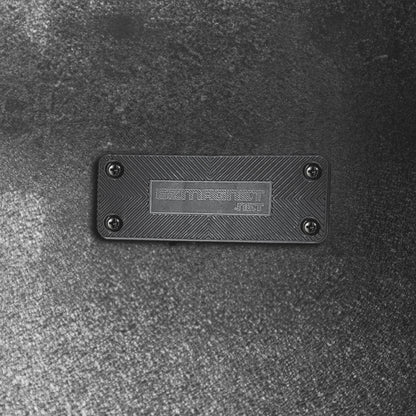 Close-up of the EZ4X4 EZ Magnet, a black rectangular gun magnet with a textured surface and EZMAGNET.NET branding.