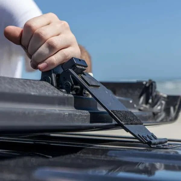 Man demonstrating EZ FlipTop hinge mechanism on Jeep, showing durable hardware for easy, one-person Freedom Panel operation.