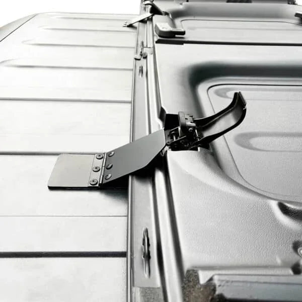 Close-up of EZ FlipTop hinge mechanism installed on Jeep roof, showcasing durable hardware for easy panel operation.