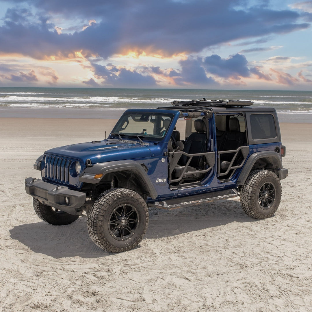 Blue Jeep with EZ4X4 black Razor half-tube aluminum doors installed on a beach, showcasing rugged, open-air design.