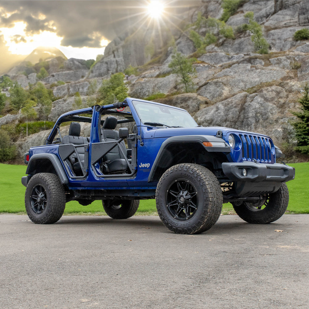 Blue Jeep Wrangler parked outdoors and equipped with EZ4X4 black Phantom Tube Doors.