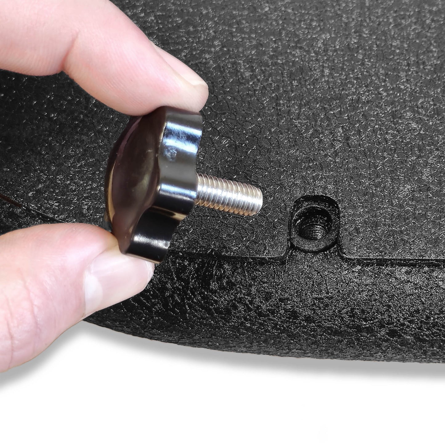 Close-up of screw securing all-weather panels to Phantom aluminum doors, highlighting secure and easy-to-install design.