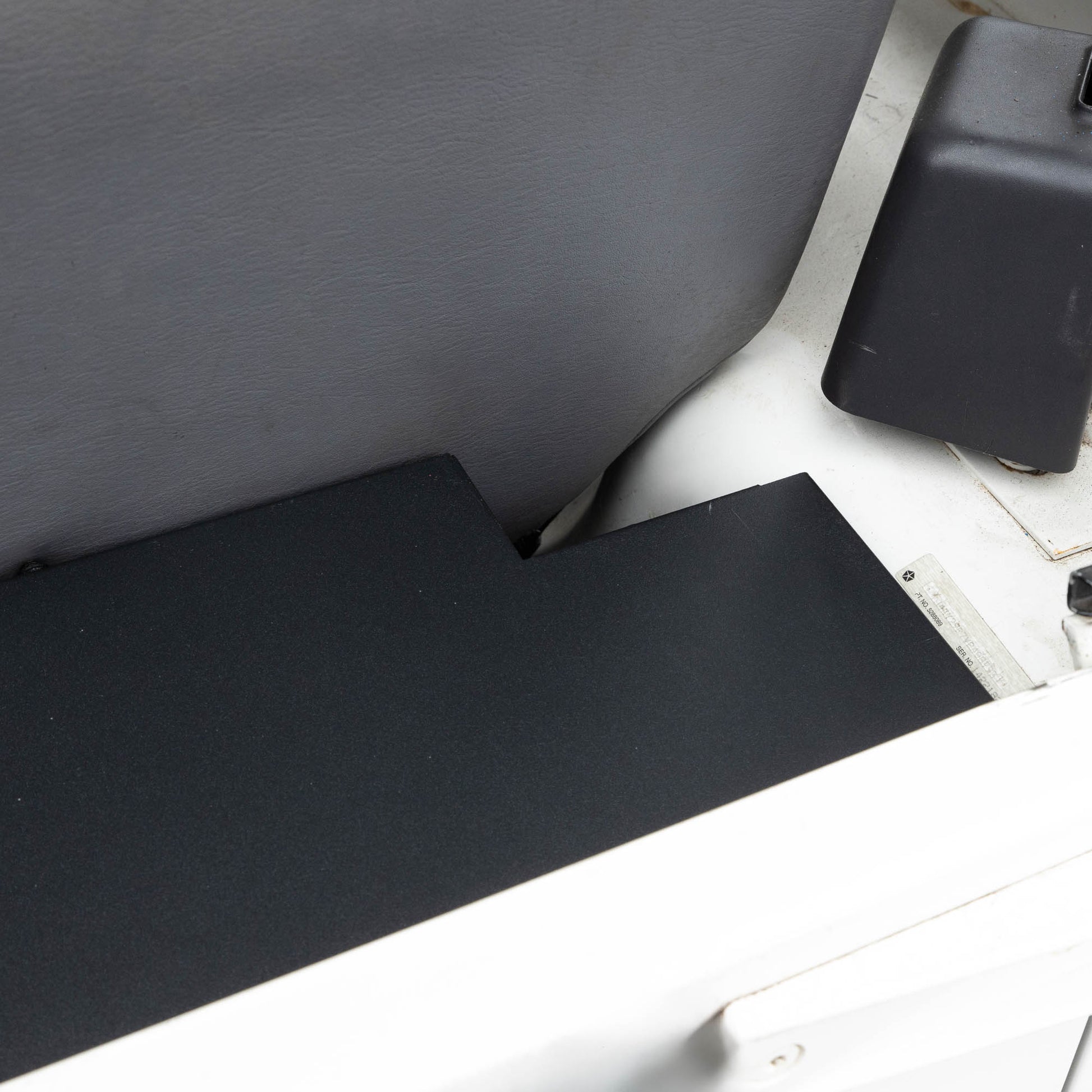 Overhead right side of EZ4X4 EZTrunk installed in white Jeep TJ with cargo door closed, showing secure storage setup.