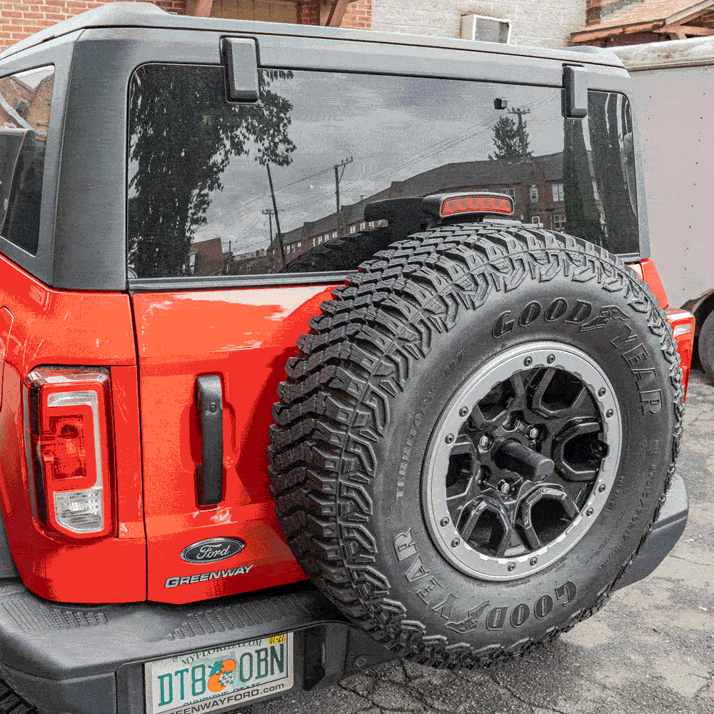 Animated GIF showing the EZ4X4 Extreme EZTRUNK folding flat and expanding inside a two-door Ford Bronco.