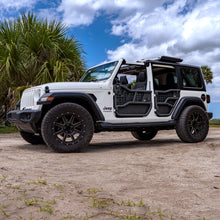 White Jeep Wrangler JLU with EZ4X4 Alpha Aluminum Tube Doors, off-road tires, and a lifted stance, set in a beach/dirt background.