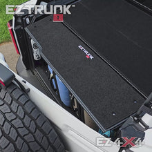 Overhead view of Ford Bronco trunk with EZTrunk modular storage system, showcasing organized cargo and secure storage space.