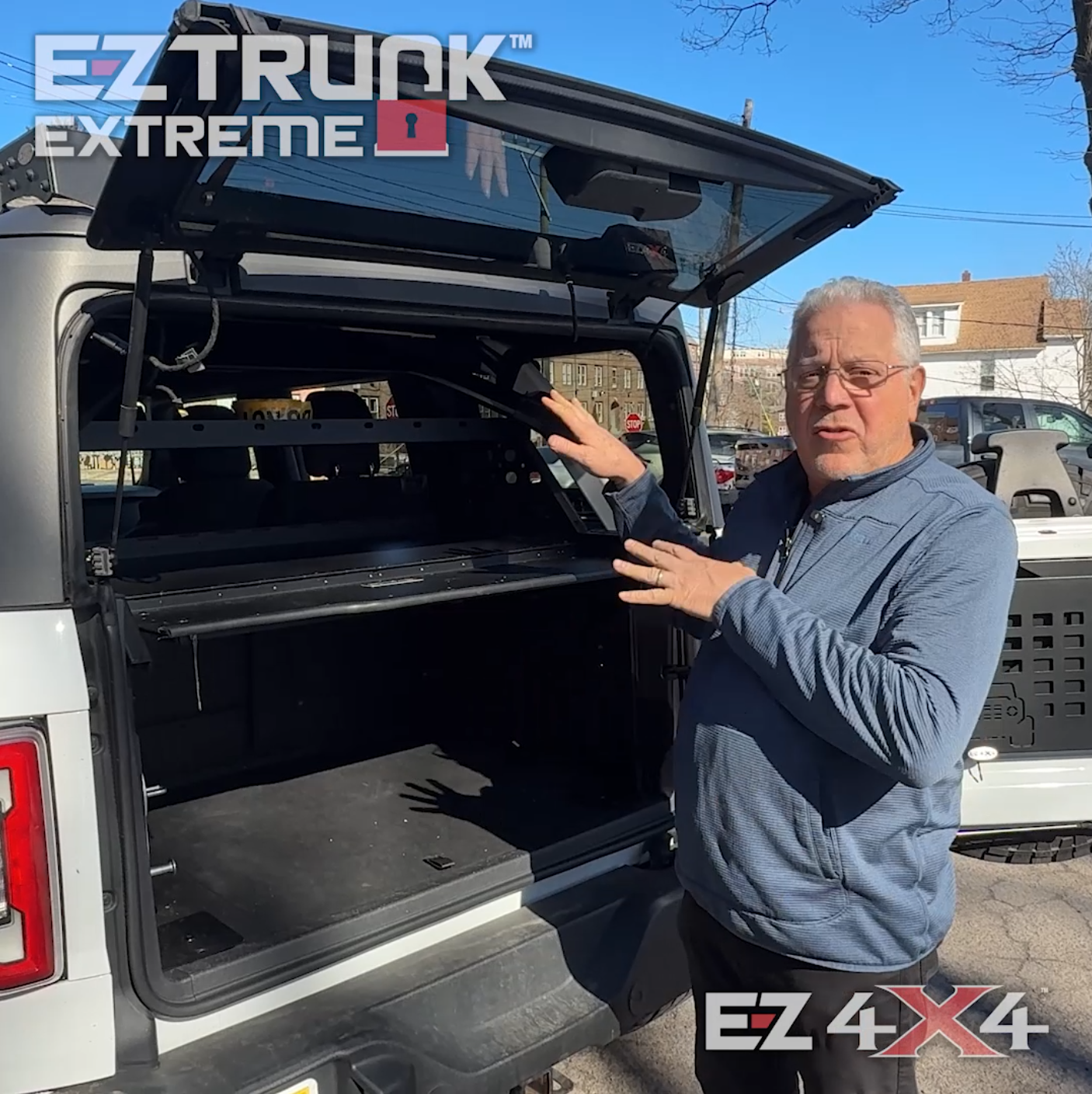 EZ4X4 Extreme EZTRUNK product overview on white Jeep Wrangler.