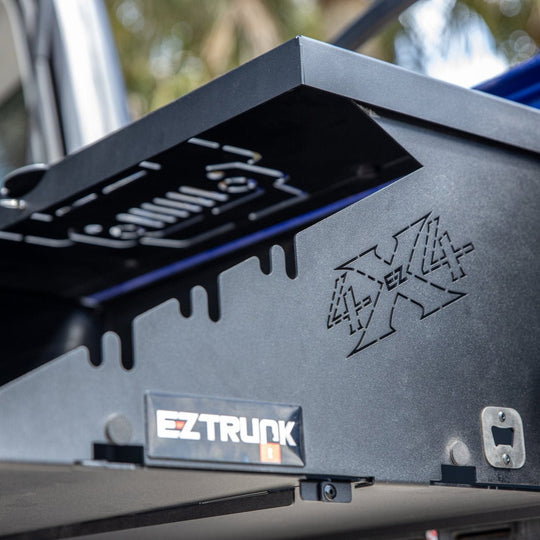 Close-up of EZ4X4 branding detail on Extreme Folding Tailgate Table, highlighting quality craftsmanship and design.